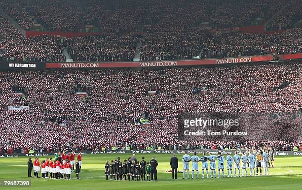 The two teams observe a minute silence in memory of the 23 victims of the Munich Air Disaster ahead of the Barclays FA Premier League match between...