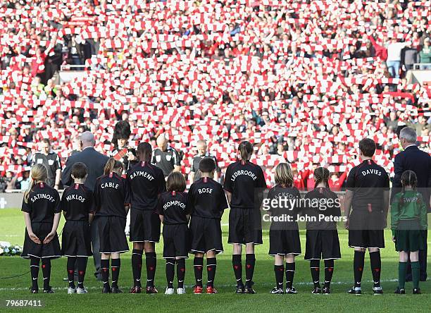 The two teams observe a munites silence in memory of the 23 victims of the Munich Air Disaster ahead of the Barclays FA Premier League match between...