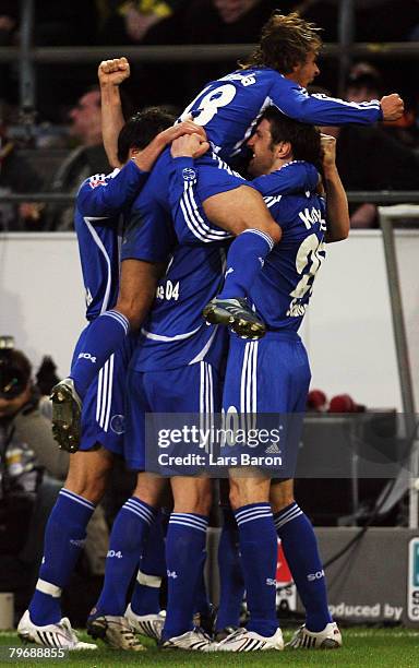 The players of Schalke celebrate after Martin Amedick of Dortmund scored a owngoal during the Bundesliga match between Borussia Dortmund and Schalke...