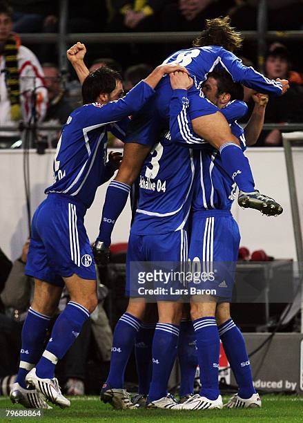The players of Schalke celebrate after Martin Amedick of Dortmund scored a owngoal during the Bundesliga match between Borussia Dortmund and Schalke...