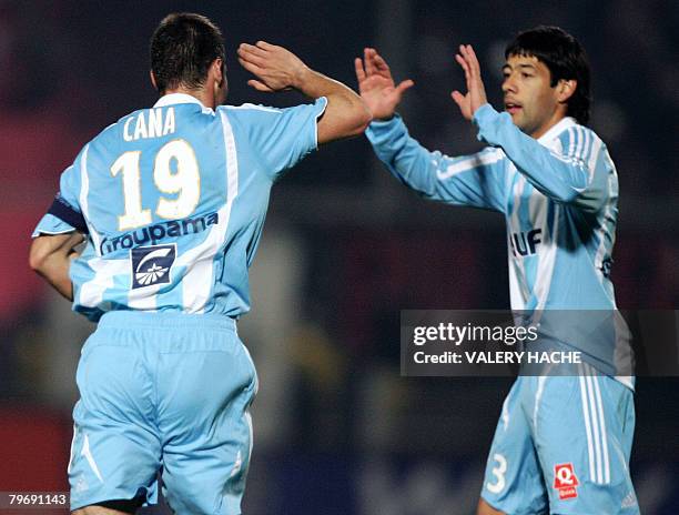 Marseille's midfielder Lorik Cana and defender Juan Angel Krupoviesa jubilates after a goal during their French L1 football match Nice vs Marseille,...