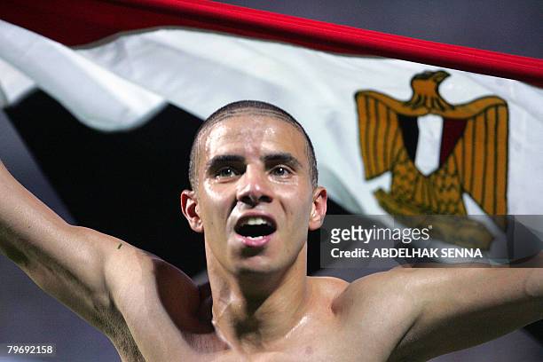 Egypt's Mohamed Zidan celebrates their victory against Cameroon on February 2008 in Accra after their final 2008 African Cup of Nations match,...