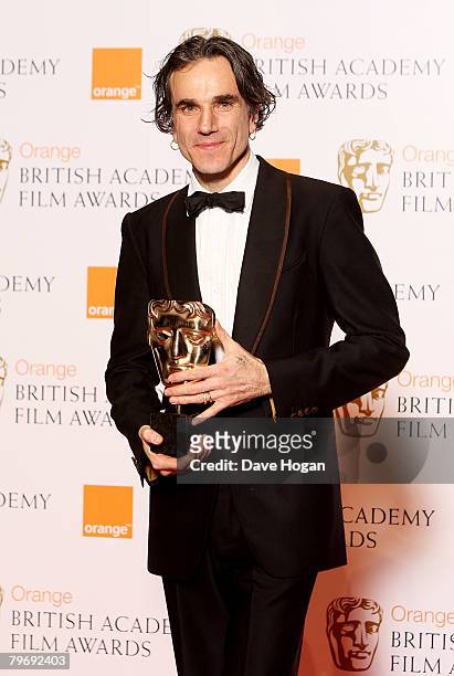 Actor Daniel Day-Lewis poses in the Awards Room with the award for Best Leading Actor at The Orange British Academy Film Awards at the Royal Opera...