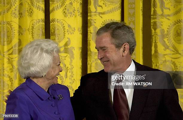 President George W. Bush shares a laugh with retired Chief Justice Sandra Day O'Connor after presenting her with the Lincoln Medal during a ceremony...