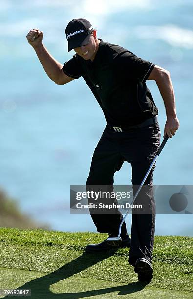 John Mallinger celebrates after making a putt on the eighth hole during the final round of the AT&T Pebble Beach National Pro-Am on Pebble Beach Golf...