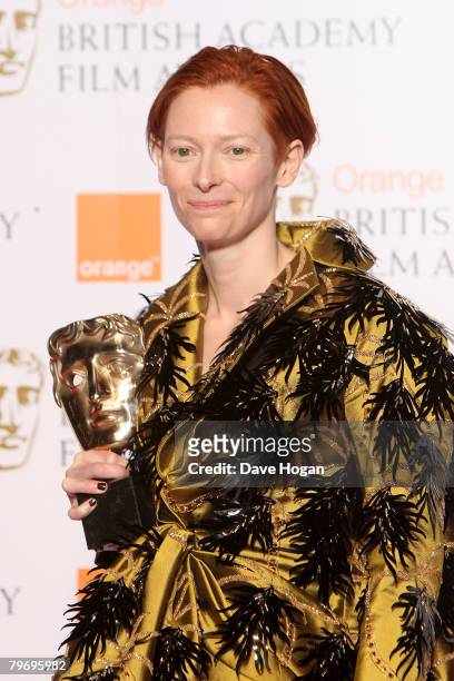 Actress Tilda Swinton poses with the award for Best Supporting Actress for her role in 'Michael Clayton' in the Awards Room at The Orange British...