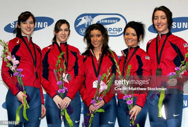Members of the US team Kimberly Derrick, Katherine Reutter, Allison Baver, Carly Wilson and Lana Gehring pose for photographers after the 3000 meter...
