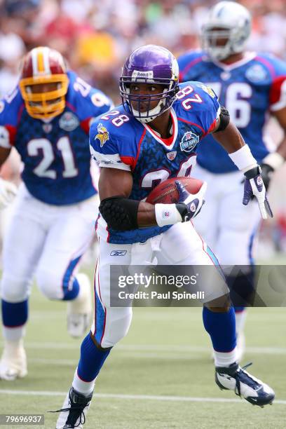 Running Adrian Peterson of the NFC's Minnesota Vikings runs the ball against the AFC during the 2008 NFL Pro Bowl at Aloha Stadium on February 10,...