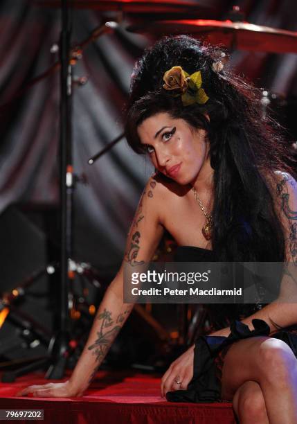 British singer Amy Winehouse looks up at a television monitor whilst awaiting news of her Grammy Award at The Riverside Studios for the 50th Grammy...