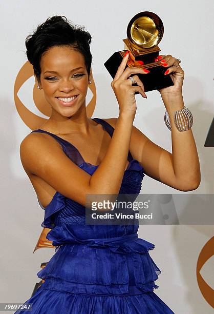 Singer Rihanna poses with the Best Rap/Sung Collaberation award in the press room during the 50th annual Grammy awards held at the Staples Center on...