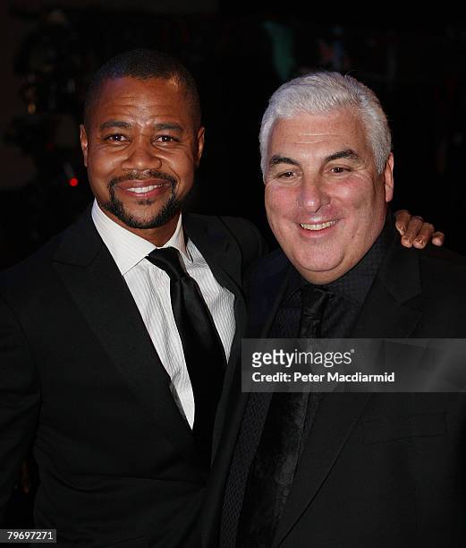 Mitch Winehouse , father of Amy Winehouse, stands with actor Cuba Gooding Jr at the Riverside Studios for the 50th Grammy Awards ceremony via video...