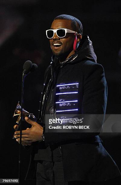 The 2008 winner for Best Rap Album Kanye West accepts the trophy at the 50th Grammy Awards in Los Angeles on February 10, 2008. AFP PHOTO/Robyn BECK