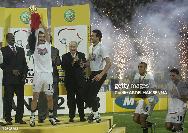The captain of Egypt's national football team Ahmed Hassan holds up the trophy of the 2008 African Nations Cup as Confederation of African Football...