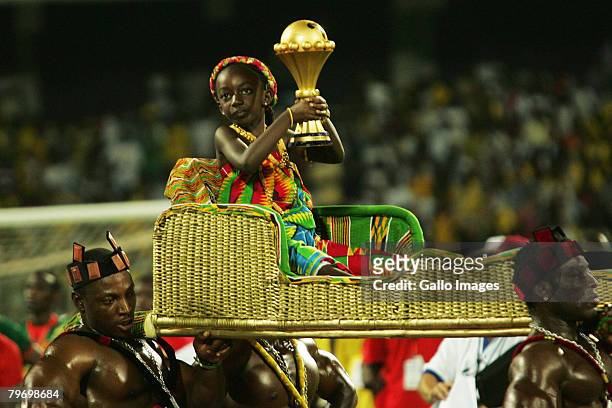 The winners' trophy is carried on to the pitch after the AFCON Final match between Cameroon and Egypt at the Ohene Djan Stadium in Accra, Ghana.