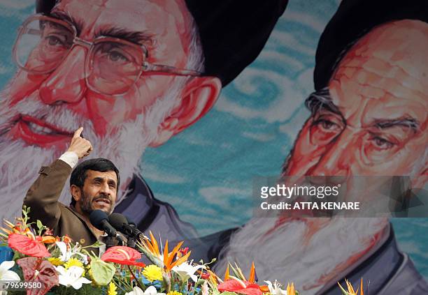 Iranian President Mahmoud Ahmadinejad gestures under a portrait of Iran's supreme leader Ayatollah Ali Khamenei and Iran's late founder of Islamic...