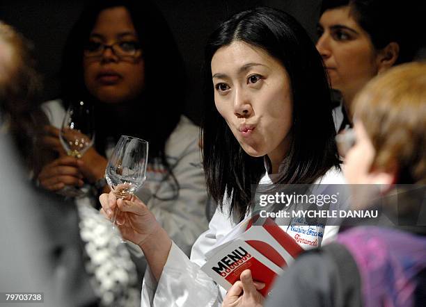 Visitor tastes some wine during the third edition of "Omnivore Food Festival" , on February 11, 2008 in Deauville. Around 50 chefs participate in...