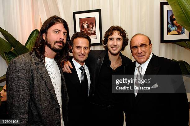 Musician Dave Grohl, COO of BMG Label Group Charles Goldstuck, singer Josh Groban, and President and CEO of BMG US Clive Davis pose during the...