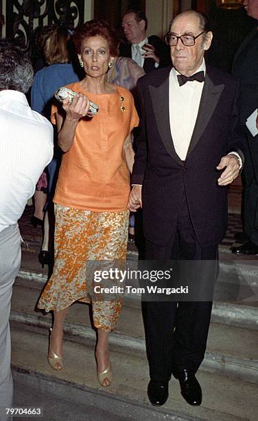 Rex Harrison with his wife Mercia Tinker attend the opening night of his play "The Admirable Crichton" on August 8, 1988 in London.