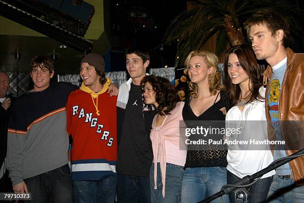 Cast members of "One Tree Hill" with Gavin Degraw in red