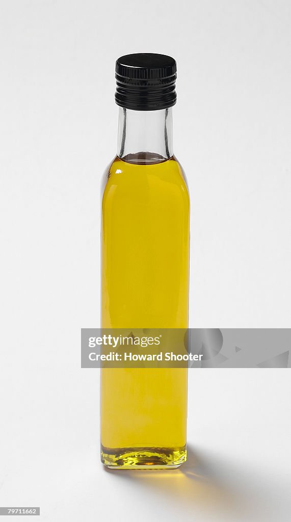 Extra virgin olive oil in a bottle, close up