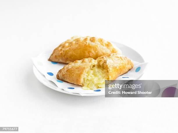 two cheese and potato pasties, napkin and plate - mushroom pie stock pictures, royalty-free photos & images