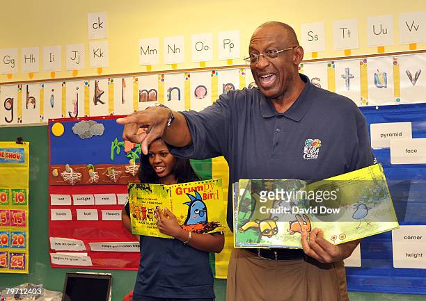 Legend Bob Lanier speaks with children from Martin Behrman Charter School at the NBA Cares Read to Achieve event during All-Star Week on February 11,...