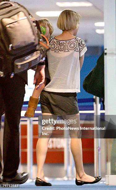 Actress Michelle Williams is seen leaving Sydney at Kingsford Smith Airport on February 10, 2008 in Sydney, Australia. Ms Williams is pictured with...