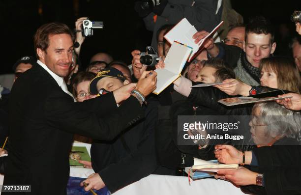 Joseph Fiennes signs autographs as he attends the "Cinema for Peace" event during day five of the 58th Berlinale International Film Festival held at...