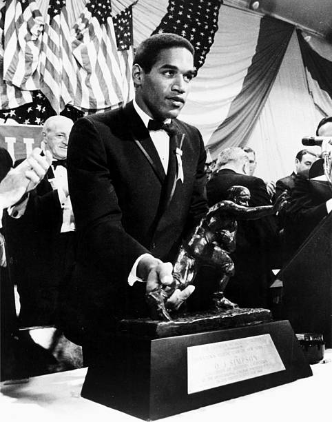 Trojans running back O.J. Simpson accepts the Heisman Trophy on December 5 at the Downtown Athletic Club in Manhattan, New York.