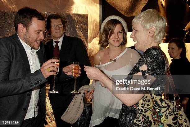 Will Young and Kate Sumner with Annie Lennox attend the VIP private view of "Vanity Fair Portraits" sponsored by Burberry, at the National Portrait...