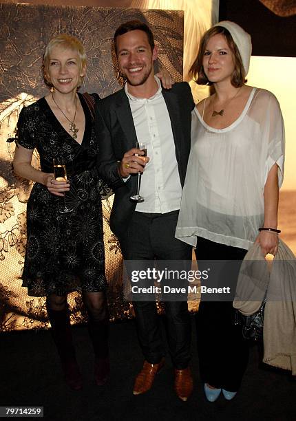 Will Young and Kate Sumner with Annie Lennox attend the VIP private view of "Vanity Fair Portraits" sponsored by Burberry, at the National Portrait...