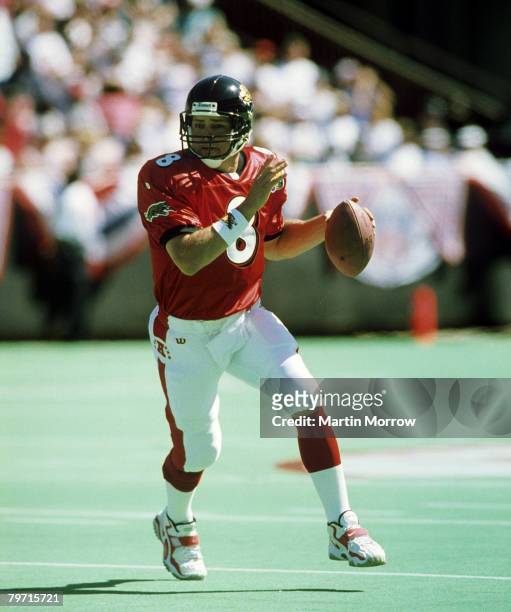 Quarterback Mark Brunell of the Jacksonville Jaguars rolls out and looks for an open receiver during the AFC's 29-24 victory over the NFC in the 1998...