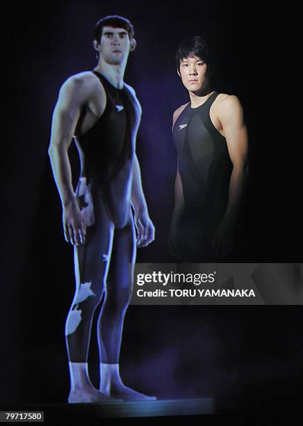 South Korean swimmer Park Tae-Hwan clad in new swimsuit "Fastskin LZR Racer" of Speedo poses beside a vertual image of US swimmer Michael Phelps...
