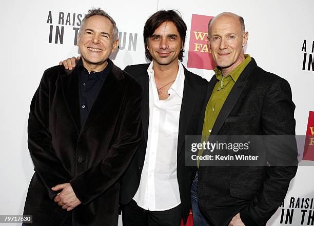 Producers Craig Zadan and Neil Meron pose with actor John Stamos at the west coast screening of the "ABC World Premiere Movie Event: A Raisin in the...