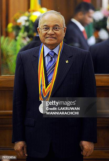 Maldivian President Maumoon Abdul Gayoom stands at a ceremony in Colombo where he was conferred Sri Lanka's highest civilian honour on February 12,...
