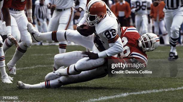 New England Patriots safety Roland James brings down Cleveland Browns Hall of Fame tight end Ozzie Newsome during a 24-20 Browns victory on October 6...