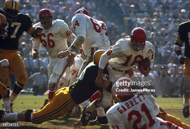 Green Bay Packers Hall of Fame linebacker Ray Nitschke wraps up Kansas City Chiefs Hall of Fame quarterback Len Dawson during Super Bowl I, a 35-10...