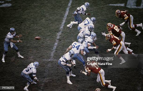 Dallas Cowboys Hall of Fame quarterback Roger Staubach receiving the snap in a 34-20 loss to the Washington Redskins on November 18, 1979 at RFK...