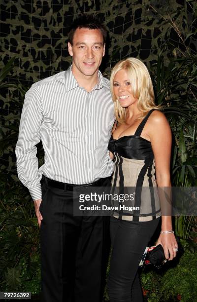 Footballer John Terry and his wife Toni Poole arrive at the UK gala premiere of 'Rambo' at the Vue cinema, Leicester Square on February 12, 2008 in...