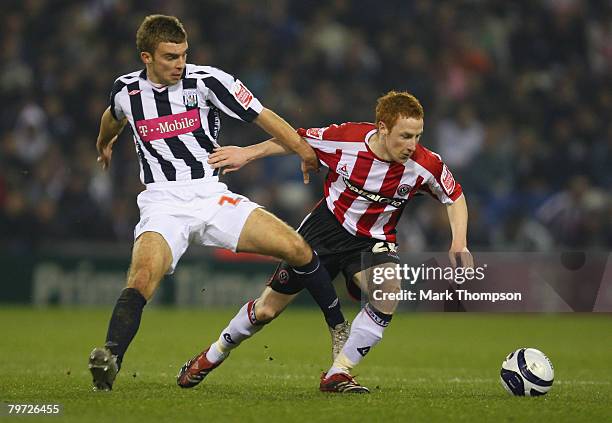 James Morrison of West Brom tangles with Stephen Quinn of Sheffield United during the Coca-Cola Championship match between West Bromwich Albion and...