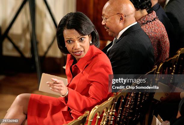 Secretary of State Condoleeza Rice speaks with other guests during an African American History Month celebration in the East Room of the White House...