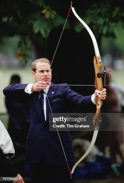 Prince Edward, Earl of Wessex tries archery during a 'Passport to Adventure' Duke of Edinburgh Award day