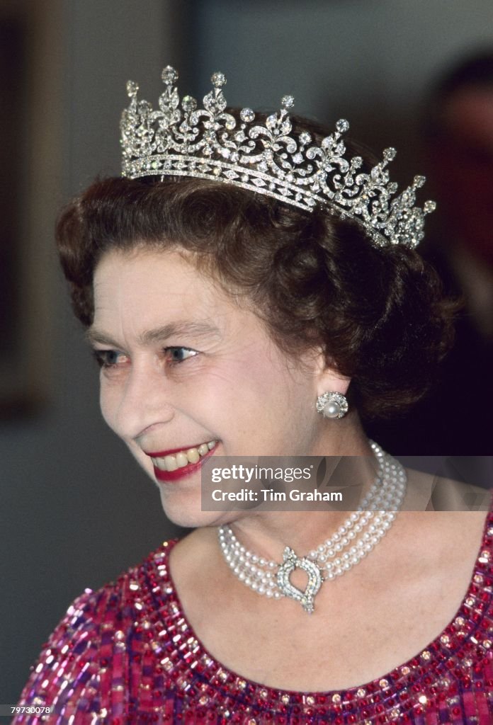 Queen Elizabeth II wears a four strand diamond and pearl cho
