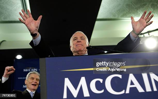 Presidential hopeful Sen. John McCain speaks to supporters as U.S. Sen. John Warner cheers during a primary night party February 12, 2008 in...