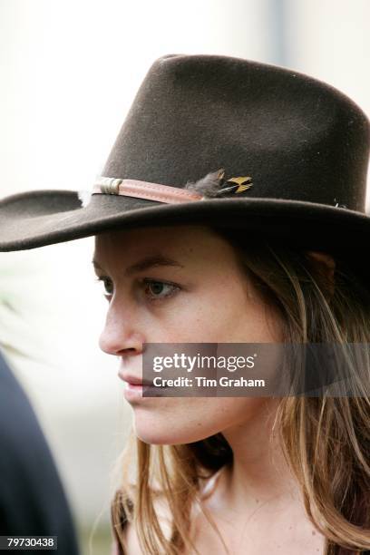 Jecca Craig, a friend of Prince William, in a fedora hat among guests at the society wedding of Hugh Van Cutsem Junior to Rose Astor at Burford...