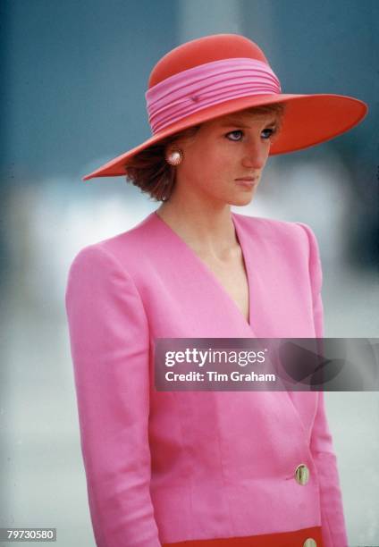 DIANA, PRINCESS OF WALES, DURING HER OFFICIAL TOUR OF KUWAIT THE PRINCESS IS WEARING A PINK AND RED CLASHING COLOURS COAT DRESS DESIGNED BY CATHERINE...