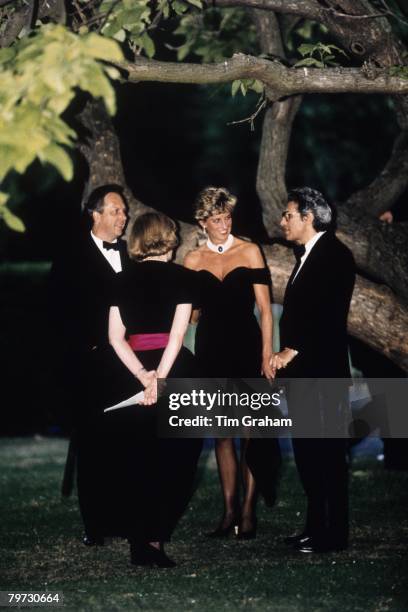 Diana, Princess of Wales wears a short black cocktail dress designed by Christina Stambolian to a Gala at the Serpentine Gallery in Hyde Park