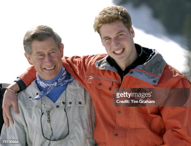 Prince Charles smiling with his teenage son Prince William at the start of their annual skiing holidays, Prince William is showing affection by...