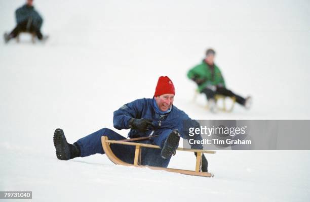 Prince Charles, Prince of Wales falling off a sledge whilst on holiday in Klosters
