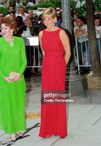 Diana, Princess of Wales with Elizabeth Dole attends a fund raising gala dinner for the American Red Cross in Washington, Diana is wearing a dress...